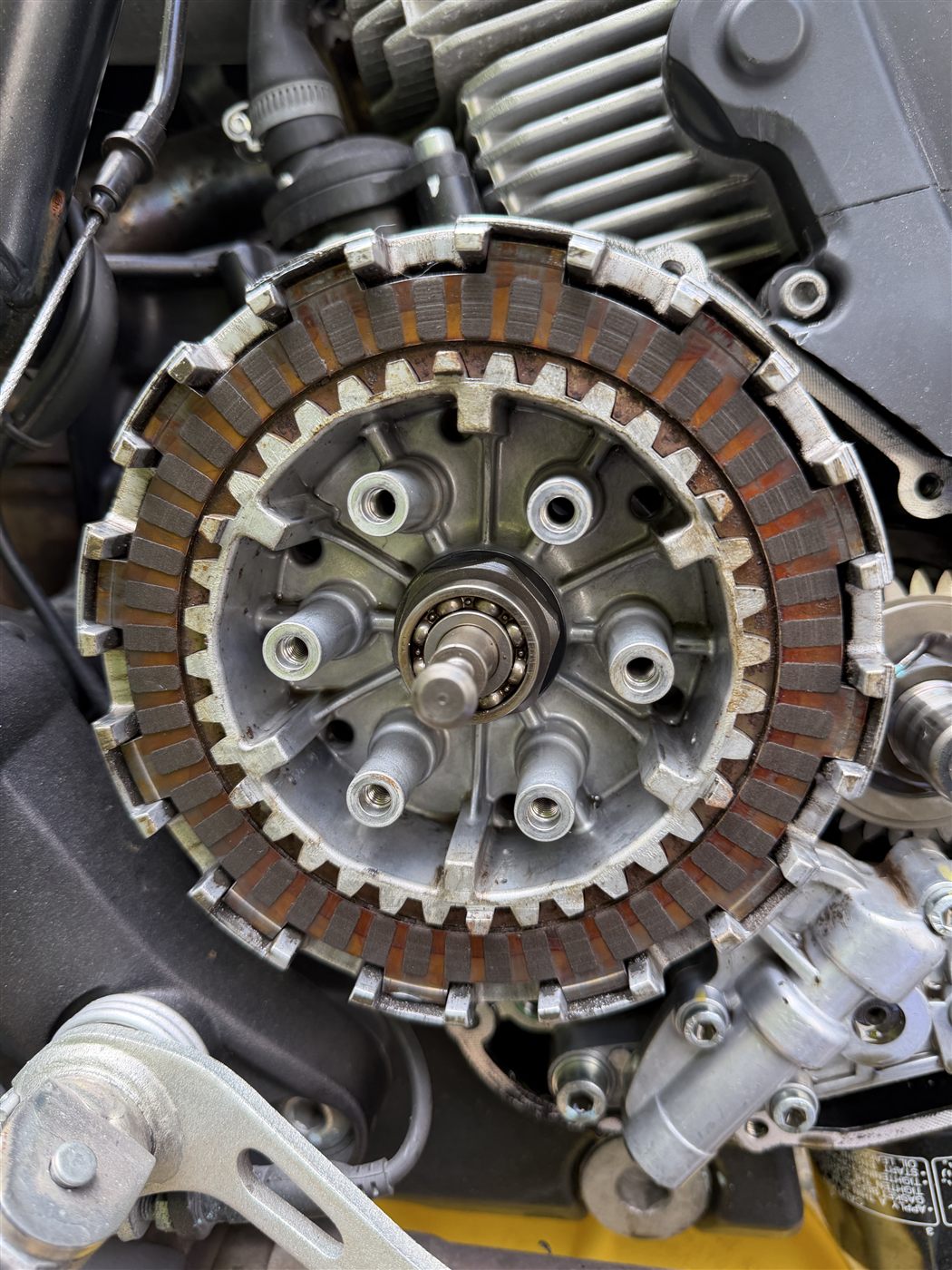 Worn Ducati Scrambler clutch plates during mobile motorcycle repair