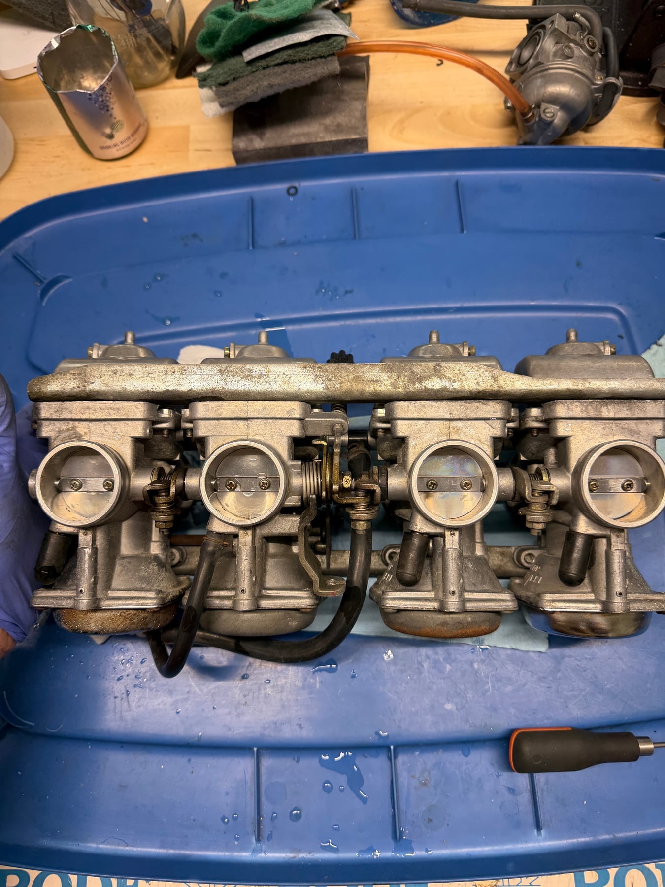 Restored Kawasaki GPZ750 four-carburetor bank after cleaning and reassembly