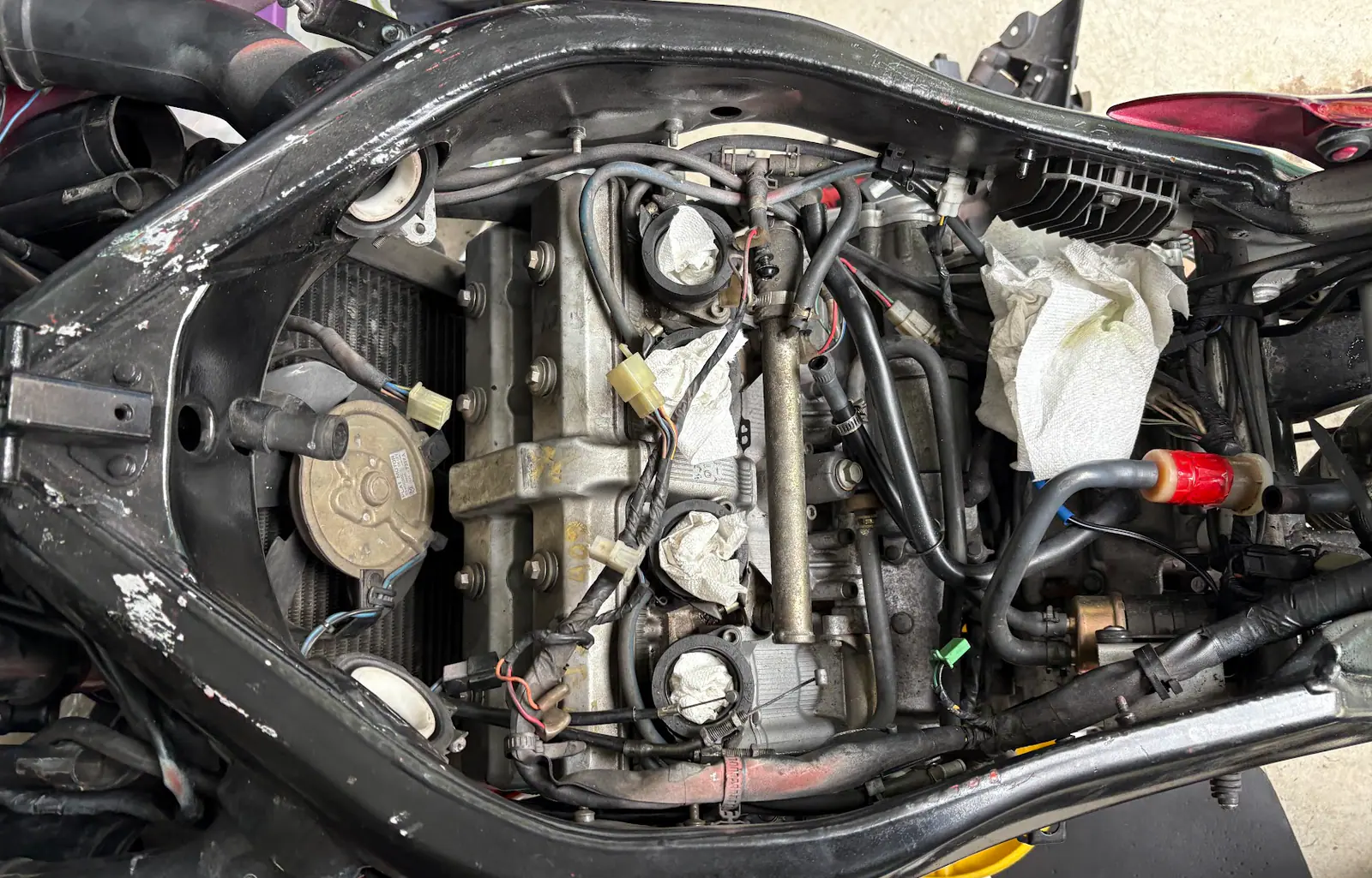 Motorcycle engine components inspected during a no-start diagnosis